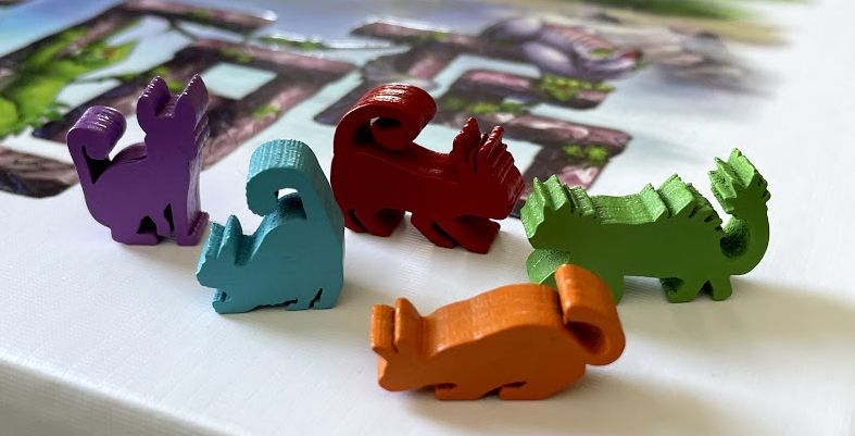 Close up of cat meeples in 5 colors