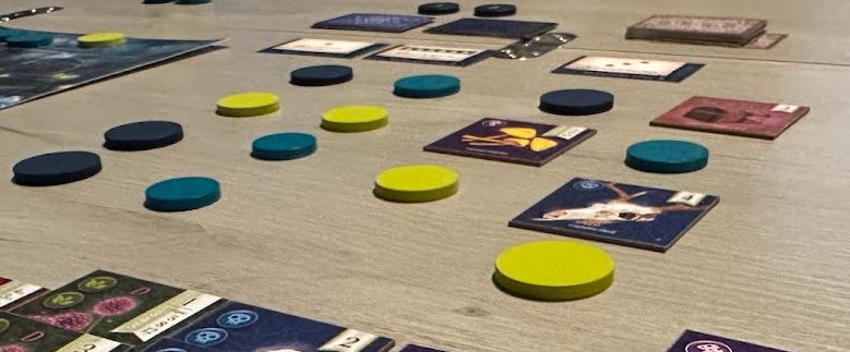 Gameplay for Nocturne showing upside-down tokens in three different colors.