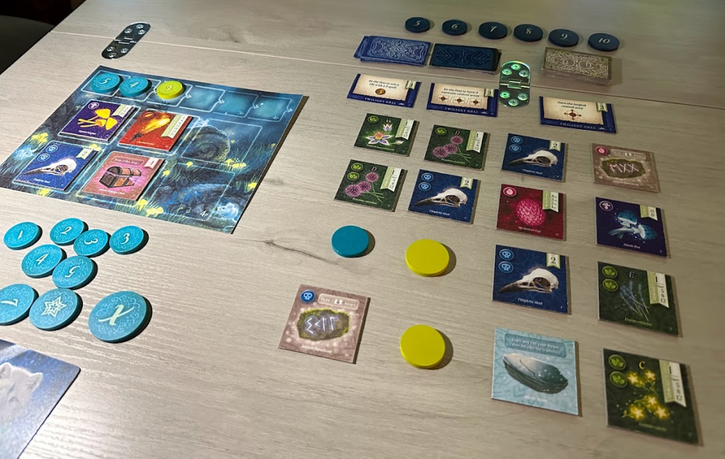Nocturne game setup that includes spell tokens for one player, offering area for the forest sprints, and a 4x4 grid of square tiles representing the forest floor.