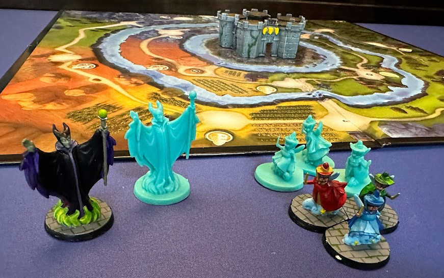 Disney Sidekicks showing painted and unpainted sculpts in the front. Background is the game board and painted castle.