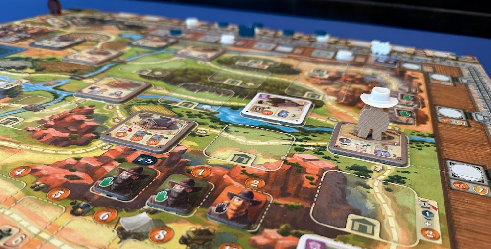 Close up of the Great Western Trail game board and game components.