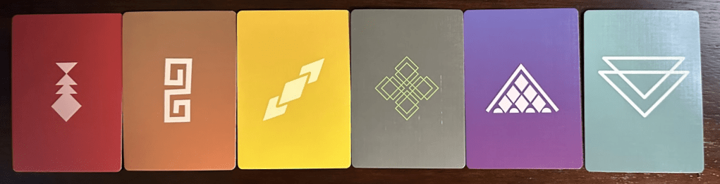 Back of six cards in six different colors. Each includes a unique icon.