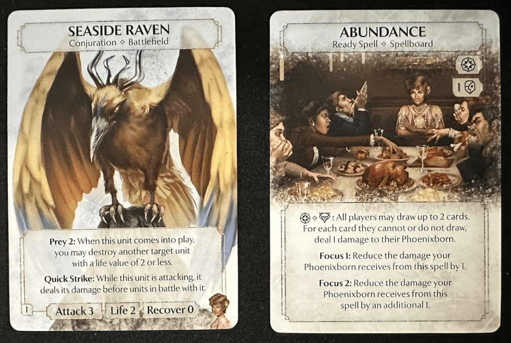 Two cards. First, Seaside Raven, shows a painting of a large raven, and includes text about this Conjuration. The second, Abundance, has a painting of a group of 5 people eating a feast.  it also includes text describing the card.