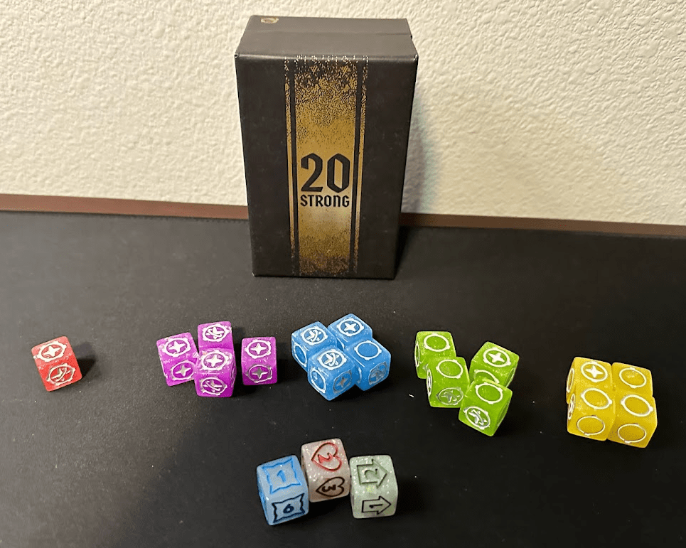 20 Strong game box and the 20 dice on a black mat.