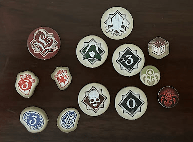 13 different tokens for Arkham Horror: The Card Game.