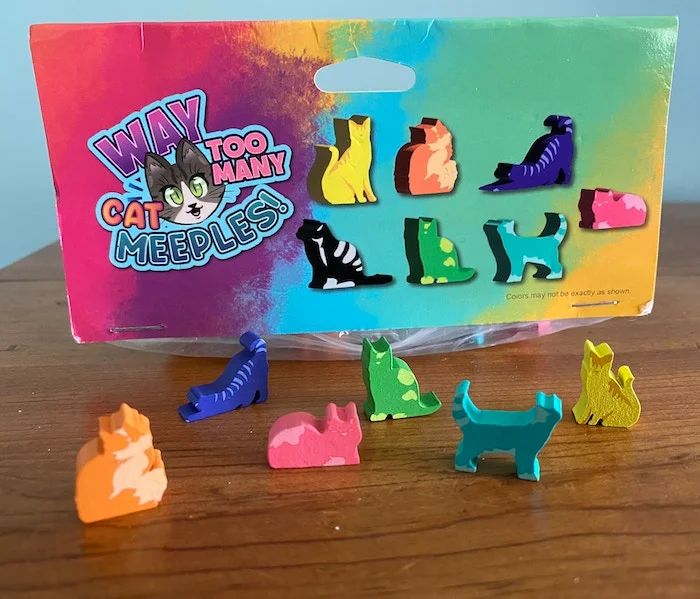 Cat meeples and logo for "Way Too Many Cat Meeples"