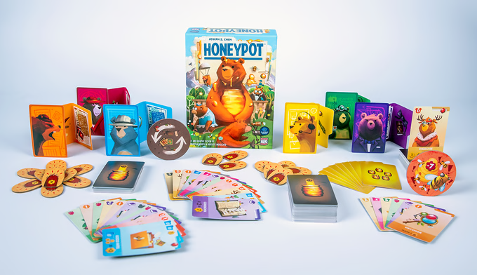 Wide shot of Honeypot game with its cards and other components.